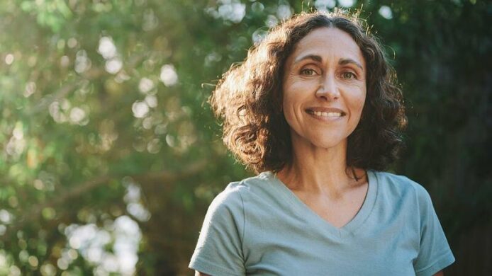 Female smiles while enjoying the outdoors